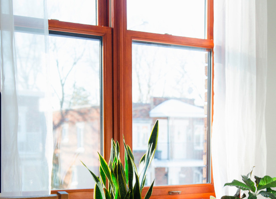 Window with low-e glass, glazing bars, & wood decor finish