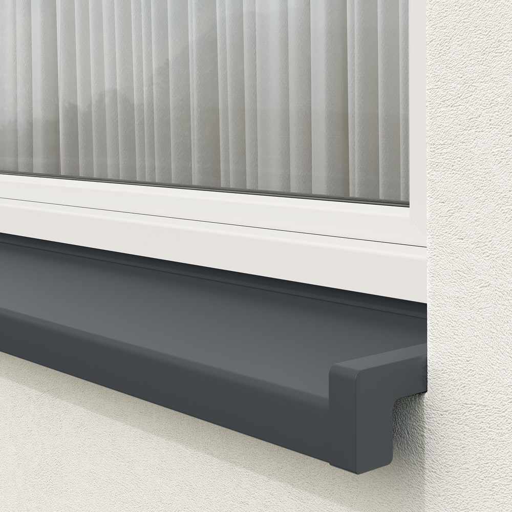 Installed exterior window sill in black-blue with sloping end caps