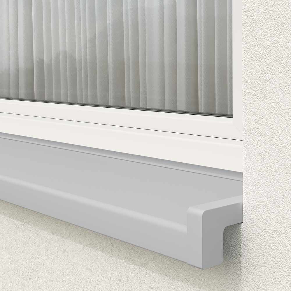 Installed exterior window sill in silver with sloping end caps