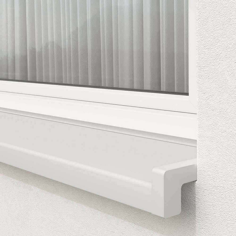 Installed exterior window sill in white with sloping end caps